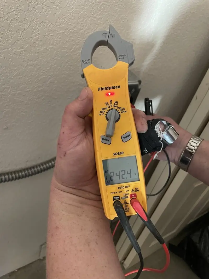 Voltage testing with clamp meter during Outlet Installation in Laughlin